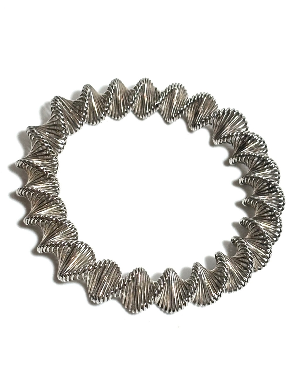 The vintage coiled wire spring Mod stretch bracelet from the 1960s is a stylish